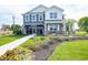 Charming two-story home with a beautifully landscaped yard and inviting front porch at 1571 Beyers St, Fortville, IN 46040