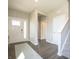 Bright foyer with hardwood floors and a staircase leading to the upper level at 1571 Beyers St, Fortville, IN 46040