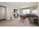 Sitting area features a comfortable sectional sofa and bright natural light at 1571 Beyers St, Fortville, IN 46040