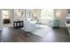 Bright living room with hardwood floors, stylish decor, and ample seating at 1571 Beyers St, Fortville, IN 46040