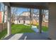 View from porch of the green backyard and detached garage at 1818 Central Ave, Indianapolis, IN 46202