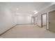 Spacious finished basement featuring neutral carpet and paint, and paneled doors at 1818 Central Ave, Indianapolis, IN 46202