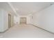 Large basement is finished with neutral carpet and paint; three doors are visible at 1818 Central Ave, Indianapolis, IN 46202