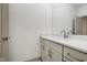 A bathroom vanity with white countertop, undermount sink, and chrome faucet complements the decor at 1818 Central Ave, Indianapolis, IN 46202