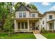 Lovely home with a welcoming front porch, nice landscaping, and healthy lawn at 1818 Central Ave, Indianapolis, IN 46202