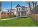 View of the home's front yard, porch, exterior, and sidewalk at 1818 Central Ave, Indianapolis, IN 46202