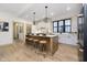 Spacious kitchen with a large island, pendant lighting, and stainless steel appliances at 1818 Central Ave, Indianapolis, IN 46202