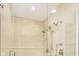 Beautifully tiled glass-enclosed shower features dual shower heads and impeccable design at 1818 Central Ave, Indianapolis, IN 46202