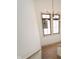 Staircase leads to upper level, illuminated by modern chandelier and window at 1818 Central Ave, Indianapolis, IN 46202