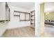 Spacious walk-in closet features custom shelving and ample storage space for an organized wardrobe at 1818 Central Ave, Indianapolis, IN 46202