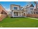 Stunning new construction shows off its covered porch and fresh green lawn at 1822 Central Ave, Indianapolis, IN 46202