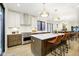 Open concept kitchen with two-tone cabinetry, island seating, and stainless steel appliances at 1822 Central Ave, Indianapolis, IN 46202