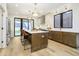 Modern kitchen with stainless steel appliances, large island, and open floor plan at 1822 Central Ave, Indianapolis, IN 46202