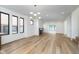 Spacious living room featuring large windows, light wood floors, and a modern fireplace at 1822 Central Ave, Indianapolis, IN 46202