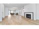 Bright, open-concept living area with light wood floors and modern fireplace at 1822 Central Ave, Indianapolis, IN 46202