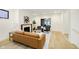 Bright living room with wood floors, a tan sofa and fireplace at 1822 Central Ave, Indianapolis, IN 46202