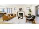 Living room with hardwood floors, tan sofa, modern art and fireplace at 1822 Central Ave, Indianapolis, IN 46202