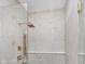 Modern shower featuring elegant marble tiling, a frameless glass enclosure, and sleek gold hardware at 1822 Central Ave, Indianapolis, IN 46202