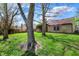 Lush backyard featuring mature trees and a well-maintained lawn, perfect for outdoor activities at 1829 Catalano Dr, Indianapolis, IN 46214