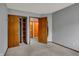 Bedroom featuring neutral walls, carpet, closet and door with wood finish at 1829 Catalano Dr, Indianapolis, IN 46214