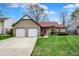 Charming home with an attached two-car garage and a well-maintained lawn, offering great curb appeal at 1829 Catalano Dr, Indianapolis, IN 46214