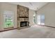 Bright living room featuring a grand stone fireplace, vaulted ceilings, and large windows for natural light at 1829 Catalano Dr, Indianapolis, IN 46214