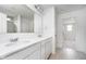 Bright bathroom with double sink vanity, large mirror, and modern fixtures at 18944 Seaforth Way, Westfield, IN 46074