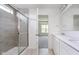 Bathroom featuring a glass-enclosed shower and a double sink vanity with ample counter space at 18944 Seaforth Way, Westfield, IN 46074