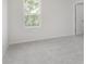 Cozy bedroom featuring a window with a view and neutral-toned carpet at 18944 Seaforth Way, Westfield, IN 46074