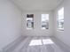 Well-lit bedroom featuring two windows and soft, neutral carpet at 18944 Seaforth Way, Westfield, IN 46074