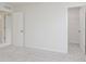 Bedroom with neutral walls and carpet, showcasing doorways to other rooms at 18944 Seaforth Way, Westfield, IN 46074