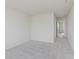 A bedroom with neutral carpet leading to a hallway at 18944 Seaforth Way, Westfield, IN 46074