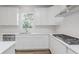 Well-lit kitchen featuring stainless steel appliances, white cabinetry, subway tile backsplash and wood floors at 18944 Seaforth Way, Westfield, IN 46074