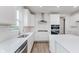 Light and airy kitchen showcasing an island, white cabinets, stainless steel appliances, and ample counter space at 18944 Seaforth Way, Westfield, IN 46074