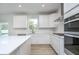 Well-lit kitchen with white cabinetry, stainless steel appliances, and a gas range at 18944 Seaforth Way, Westfield, IN 46074