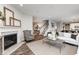 Open living room with fireplace, hardwood floors, and neutral decor at 18944 Seaforth Way, Westfield, IN 46074