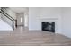 Spacious living room with fireplace, wood floor, staircase and entry foyer at 18944 Seaforth Way, Westfield, IN 46074