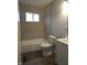 Renovated bathroom with new tiling, fixtures, and vanity at 1931 Brentwood Dr, Anderson, IN 46011