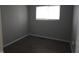 Bedroom featuring new flooring and a window providing natural light at 1931 Brentwood Dr, Anderson, IN 46011