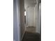 Hallway featuring hardwood flooring, leading to various rooms within the home at 1931 Brentwood Dr, Anderson, IN 46011