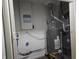 Water heater, furnace, and other utilities are neatly arranged in the utility room at 1931 Brentwood Dr, Anderson, IN 46011