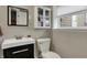 Cozy bathroom featuring a sleek vanity, modern fixtures, and a mirrored wall cabinet for ample storage at 2001 Winchester Dr, Indianapolis, IN 46227