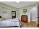 Light-filled bedroom features hardwood floors and comfortable decor at 2001 Winchester Dr, Indianapolis, IN 46227