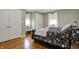 Comfortable bedroom featuring hardwood floors, ample closet space, and a calm, neutral color palette at 2001 Winchester Dr, Indianapolis, IN 46227