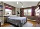 Cozy bedroom with a large window, built-in shelving, and a comfortable bed for a restful night's sleep at 2001 Winchester Dr, Indianapolis, IN 46227