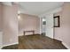Bonus room featuring neutral walls, luxury vinyl plank flooring and access to another room at 2001 Winchester Dr, Indianapolis, IN 46227