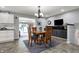 Inviting dining area featuring a stylish light fixture, built-in cabinets, and easy access to the adjacent living spaces at 2001 Winchester Dr, Indianapolis, IN 46227