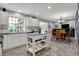 Spacious kitchen with an island, white cabinets, stainless steel appliances, and a sink overlooking the yard at 2001 Winchester Dr, Indianapolis, IN 46227