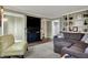 Cozy living room with modern entertainment center, sectional couch and decorative chair at 2001 Winchester Dr, Indianapolis, IN 46227