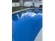 The crystal blue pool and white surroundings are a backyard oasis for relaxation and recreation at 2001 Winchester Dr, Indianapolis, IN 46227